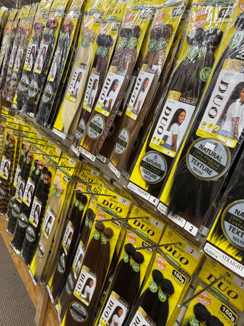 Avanti Duo double packs of straight and deep wave bundles in several colors, hanging on the wall at Angel Beauty Supply